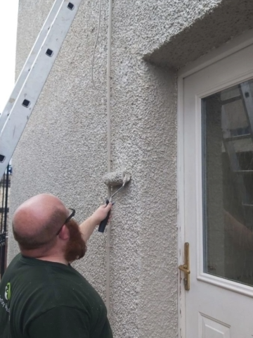 Damp Specialists applying Damp proofing colour coating