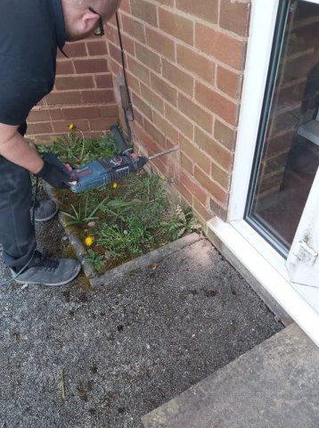Rising damp experts from Weatherdry currently shown treating damp using Dryrods